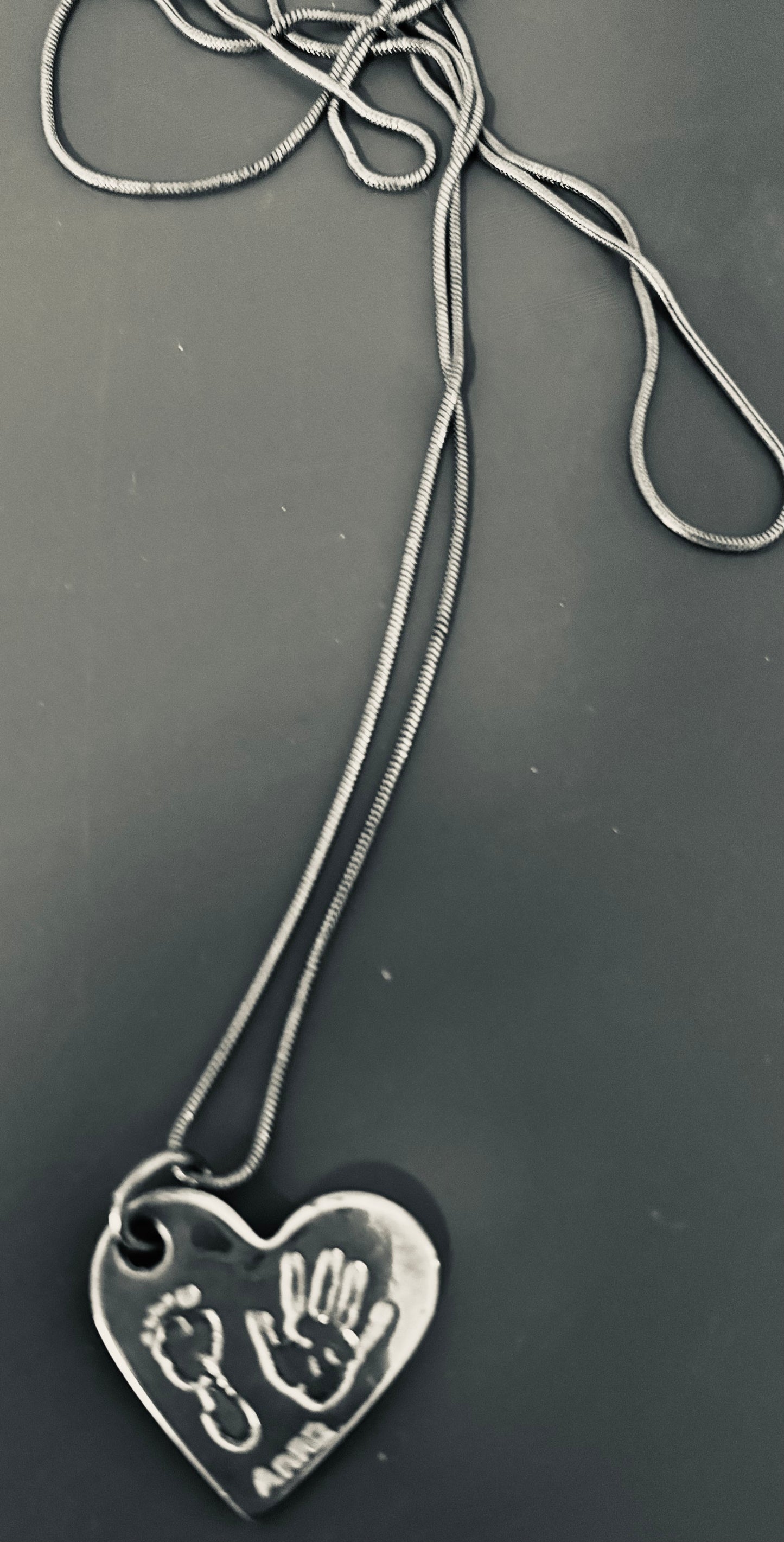 Silver Necklace with tiny baby hand/foot print