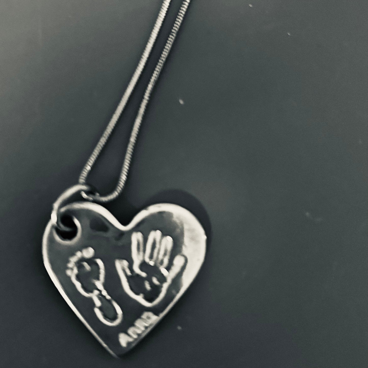 Silver Necklace with tiny baby hand/foot print