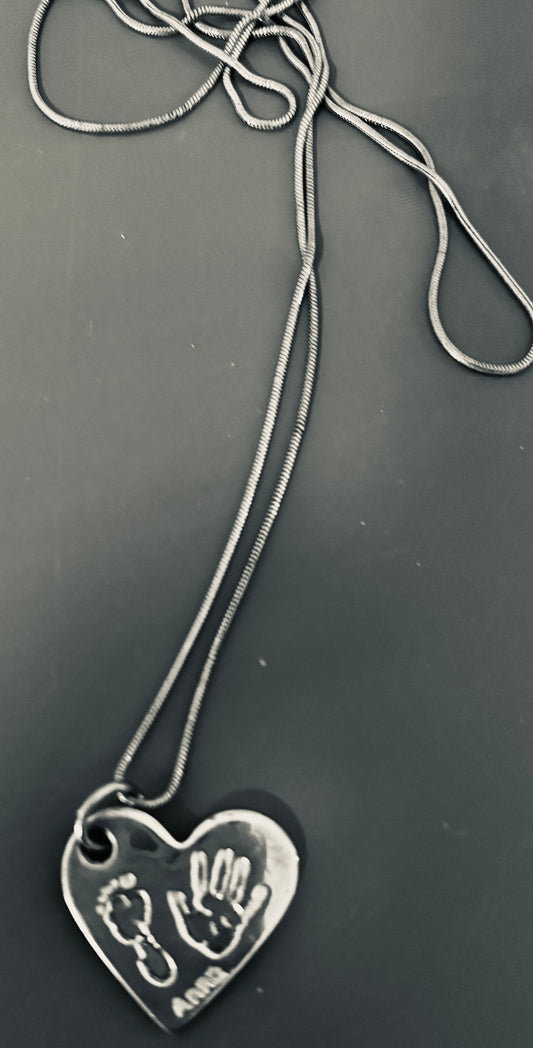 Silver Necklace with tiny baby hand/foot print